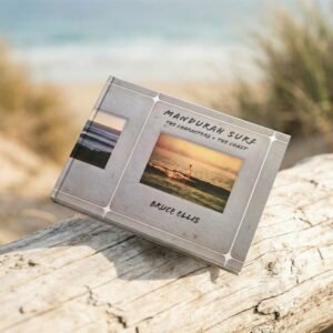 Mandurah Surf The Characters and The Coast book by Bruce Ellis photographed on coastal timber with dunes in the background
