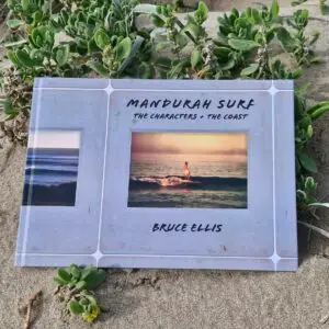 Mandurah Surf book by Bruce Ellis photographed on the sand